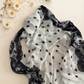 Polka dot printed modal hijab scarf by The M Essentials displayed in a flat lay.