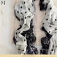 Polka dot printed modal hijab scarf by The M Essentials displayed in a flat lay.