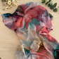 Watercolor-style printed modal hijab featuring an artistic paint-inspired pattern by The M Essentials.