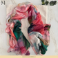 Watercolor-style printed modal hijab featuring an artistic paint-inspired pattern by The M Essentials.
